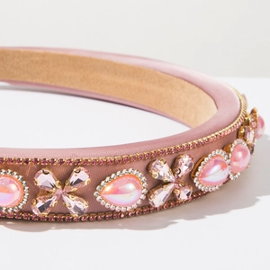 Detail of pink baroque fabric headband with rhinestones and floral crystal gems