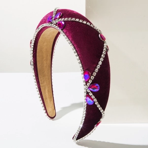 Detail of burgundy velvet headband with crystal floral pattern and sparkling rhinestones