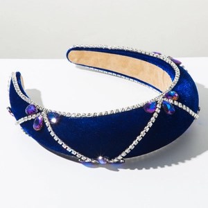 Detail of blue velvet baroque headband with sparkling rhinestones and teardrop gemstones