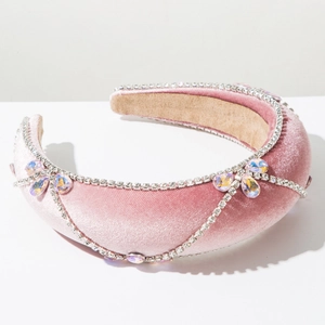 Detail of pink velvet headband with sparkling rhinestone chains and waterdrop crystals