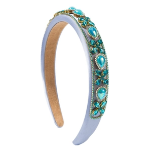 Baroque style padded headband featuring sparkling blue rhinestones and gems on satin