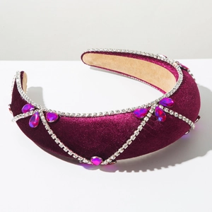 Detail of purple velvet baroque headband with rhinestone chains and gemstones
