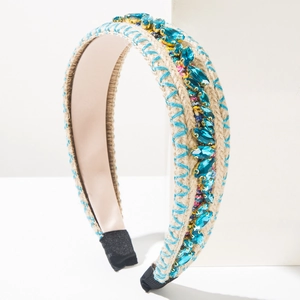 Detail of knit headband featuring vibrant colorful rhinestones and soft pink inner lining