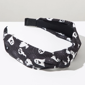 Detail of Halloween fabric headband with white ghost and spider web prints on black base