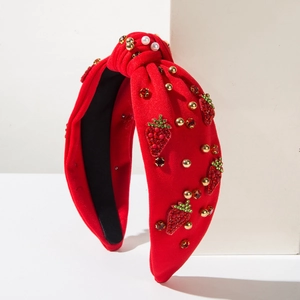 Red velvet knotted headband with beaded strawberry embroidery and pearl accents