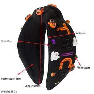 Detailed view of Halloween headband with beaded TRICK letters and pumpkin ornaments