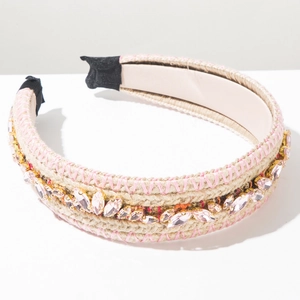 Detail of hand-woven headband with pink crystals and bohemian straw braid texture