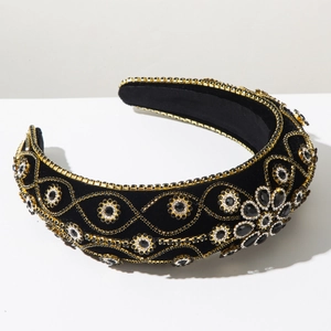 Detailed view of luxury baroque headband featuring black velvet with gold beads and crystals