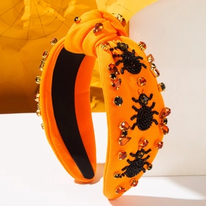 Cerchietto arancione con nodo e ragni di perline e strass per feste di Halloween