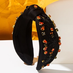 Cerchietto a nodo stile dark con ragno di perline e strass arancioni per Halloween