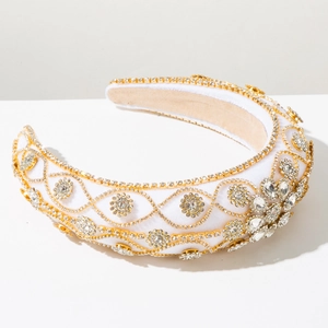 Detailed close-up of Baroque style wide headband with gold chains and crystals