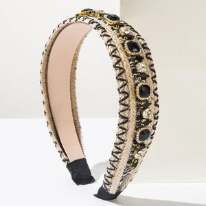 Close-up of bohemian headband with black gemstones, rhinestones and woven texture