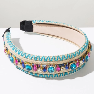 Detail of bohemian knitted headband with colorful rhinestones on natural braided rope