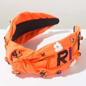 Detail of Halloween headband with beaded TRICK lettering, ghosts and pumpkin charms