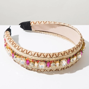 Detail of bohemian hand-woven headband with colorful rhinestones and gold settings