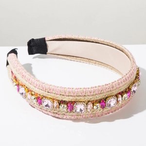Close-up of bohemian hand-woven headband with pink crystals and intricate beaded details