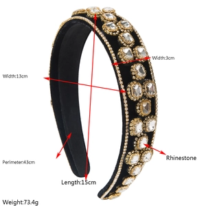 Detail view of Baroque black velvet wide headband with large rhinestones and gold trim