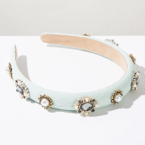 Detail showing vintage light blue fabric headband with pearls and gemstone embellishments