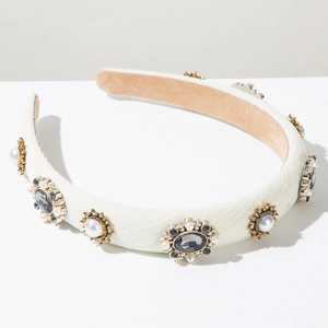 Detail of high-quality vintage fabric headband with rhinestones and faux pearls
