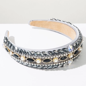 Detail of baroque headband with gray rhinestones and pearls on satin fabric