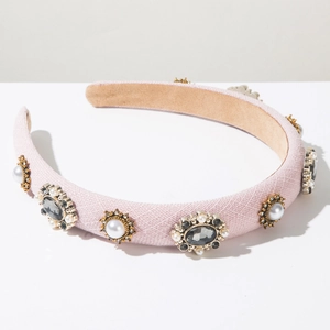 Detail of vintage fabric headband with rhinestones, pearls and palace style ornaments