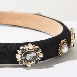 Detail of vintage headband with crystals, pearls, and sun-flower metal ornaments