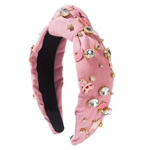 Pink knotted wide headband with sparkling crystals, pink bears, and Kiss Me lip charms