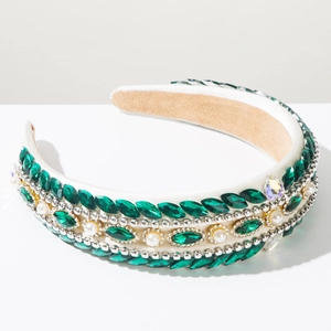 Detail of luxury baroque headband with green crystals, white pearls and silver beaded chain