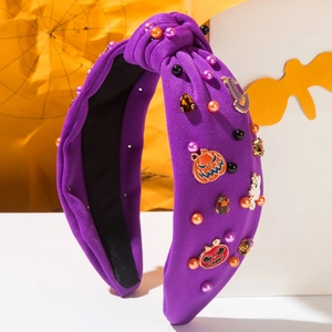 Halloween Haarreif in Lila mit Perlen sowie Kürbis und Geist Motiven auf knotigem Stoff