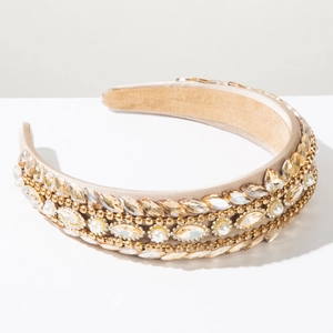 Detail of baroque headband with champagne crystals and pearls on satin fabric