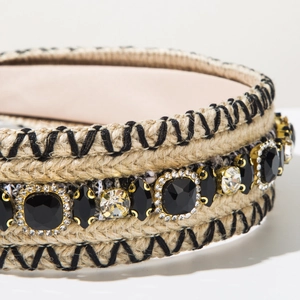 Detailed close-up of Bohemian woven headband with sparkling black and clear rhinestones