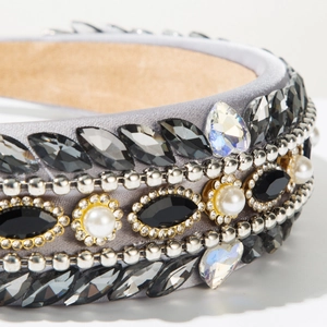 Macro detail of Baroque headband with black rhinestones, white pearls, and grey satin trim