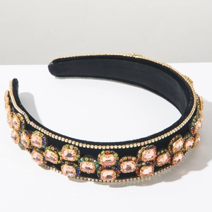 Close-up of Baroque velvet headband with pink gemstones and multicolor crystals