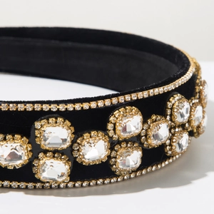 Detail of baroque black velvet headband with large square rhinestones and gold claw chains