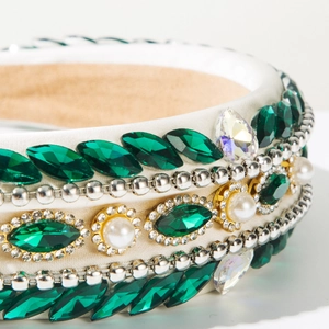 Close-up of Baroque headband with green crystals, white pearls, and silver beads