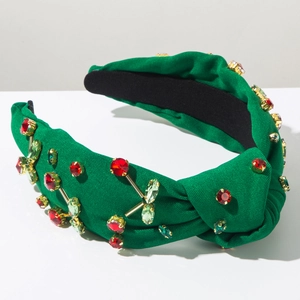 Dettaglio di fascia verde con strass a motivo ciliegia e fodera antiscivolo interna