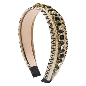 Bohemian beige woven headband featuring black embroidery and large sparkling gemstones