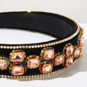 Detail of velvet Baroque headband with pink rectangular crystals and colorful rhinestones
