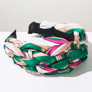 Macro detail of Bohemian braided headband with satin geometric rope and chain print