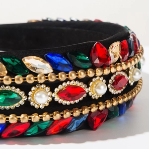 Detail of baroque headband with colorful rhinestones, faux pearls and gold bead chains