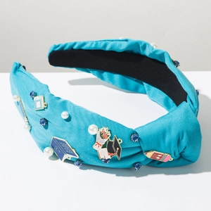Detailed view of school-themed headband featuring pearl beads and enamel pencil icons