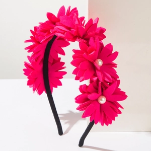 Detail view of rose red fabric flower headband with pearl center and black fabric band