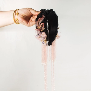 Detail of Chinese vintage headband with phoenix embroidery and long pink beaded tassels