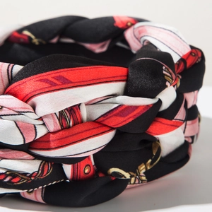 Detailed view of bohemian braided headband featuring luxury chain print satin fabric