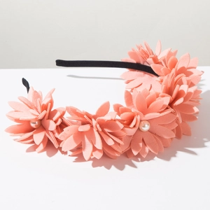 Detail of pink chiffon flowers and white pearls on a slim black Korean fashion headband