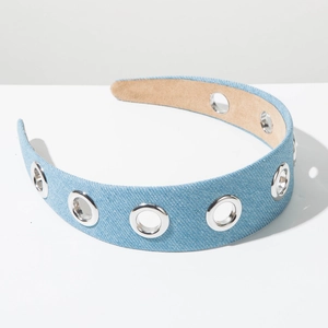 Detail showing light blue denim headband texture with silver metal eyelets decoration