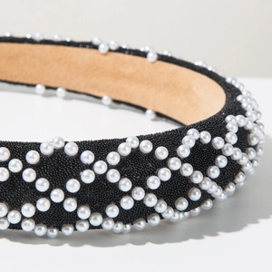Detail of wide pearl headband with black beads and soft brown velvet lining