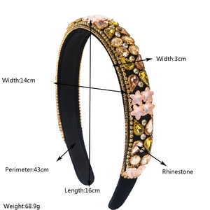 Detailed view of Baroque star headband with multi-colored rhinestones and gold bead trim