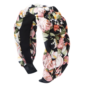 Fashionable wide braided floral headband with vintage flower pattern on black fabric