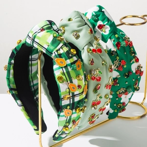 Three-piece set of knotted headbands featuring fruit motifs and sparkling rhinestones